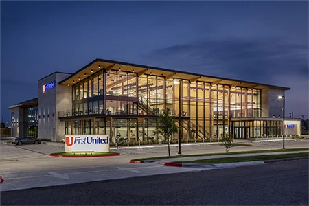 View of First United Bank building featuring steel-framed curtain walls.